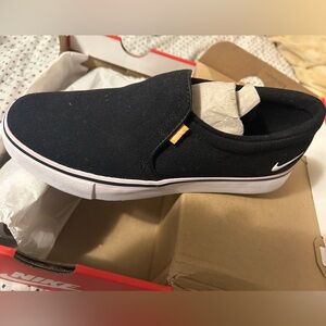 Nike Womens Black and White Slip-On Sneakers